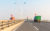 container-trucks-on-cross-sea-bridge-P9KMM7M