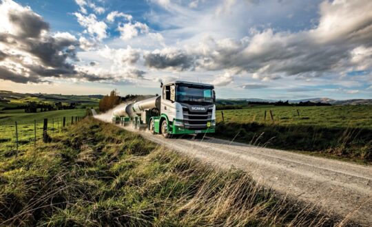 Milk tanker driving on a rural road