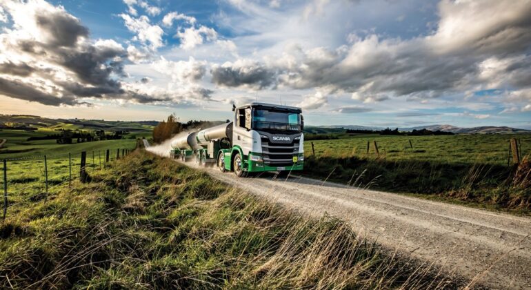 Milk tanker driving on a rural road