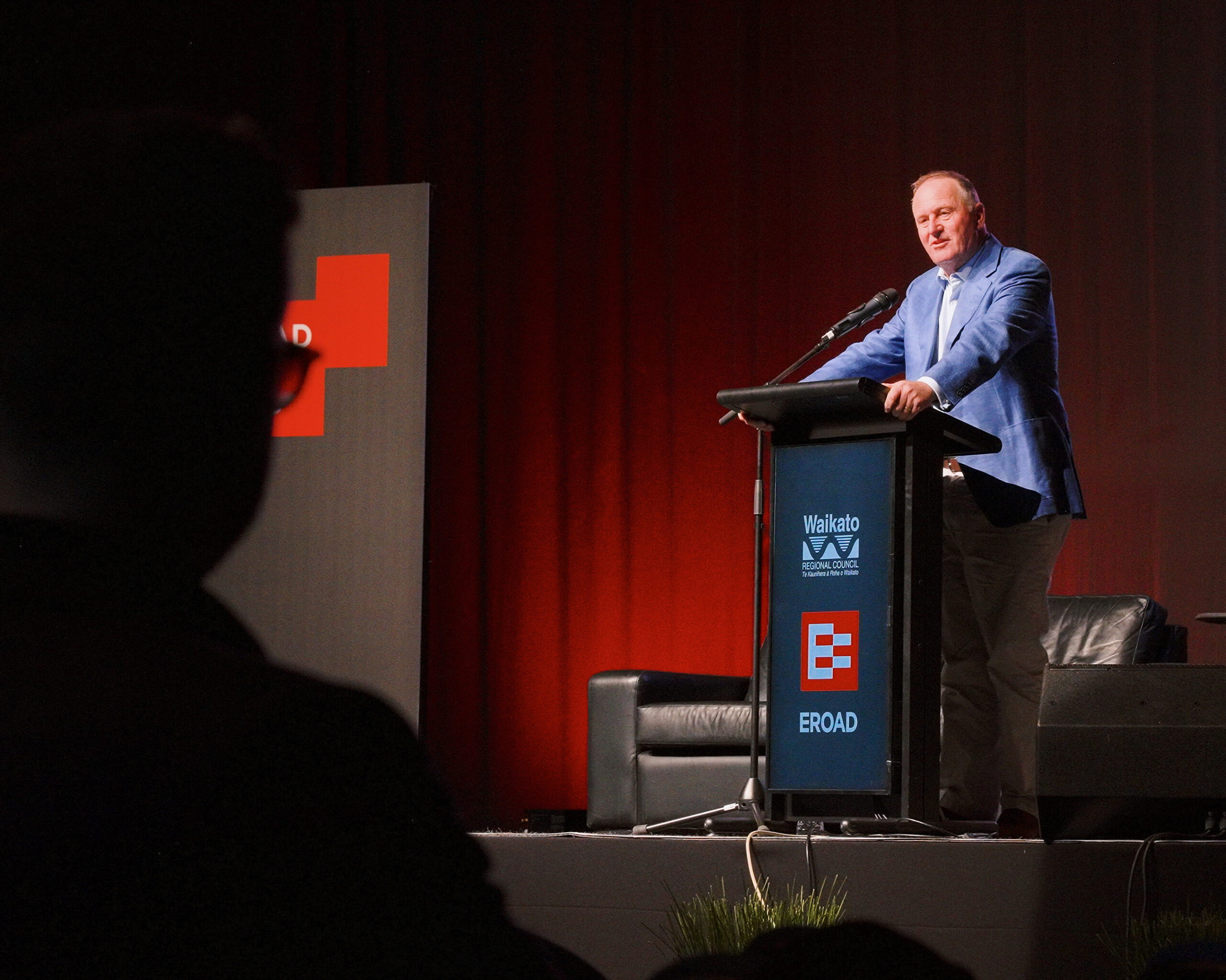 Former Prime Minister, Sir John Key presents on stage at EROAD Fleet Days 2026