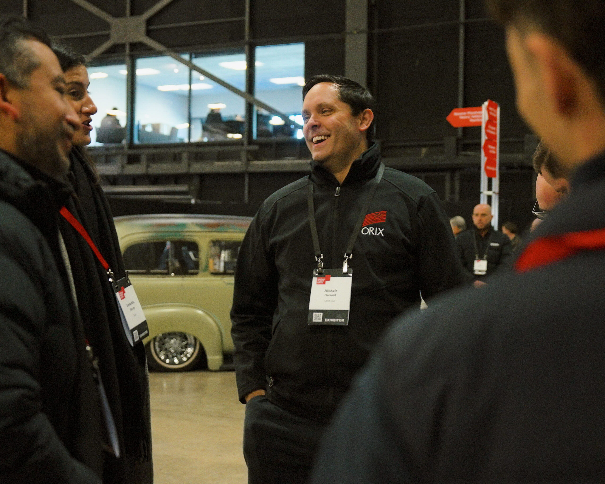 Fleet professionals connecting at EROAD Fleet Days 2026 networking event with Fonterra truck in background